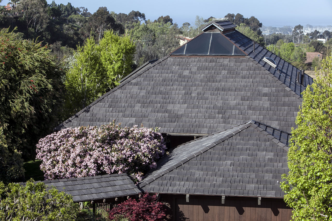 Steep Roof Pitch No Problem for Roofer Installing Polymer Shake Tiles