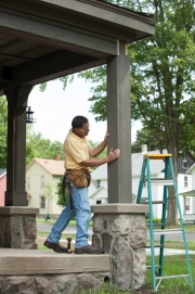 The completed column wrap is inspected by contractor Steve Roth after being finished.